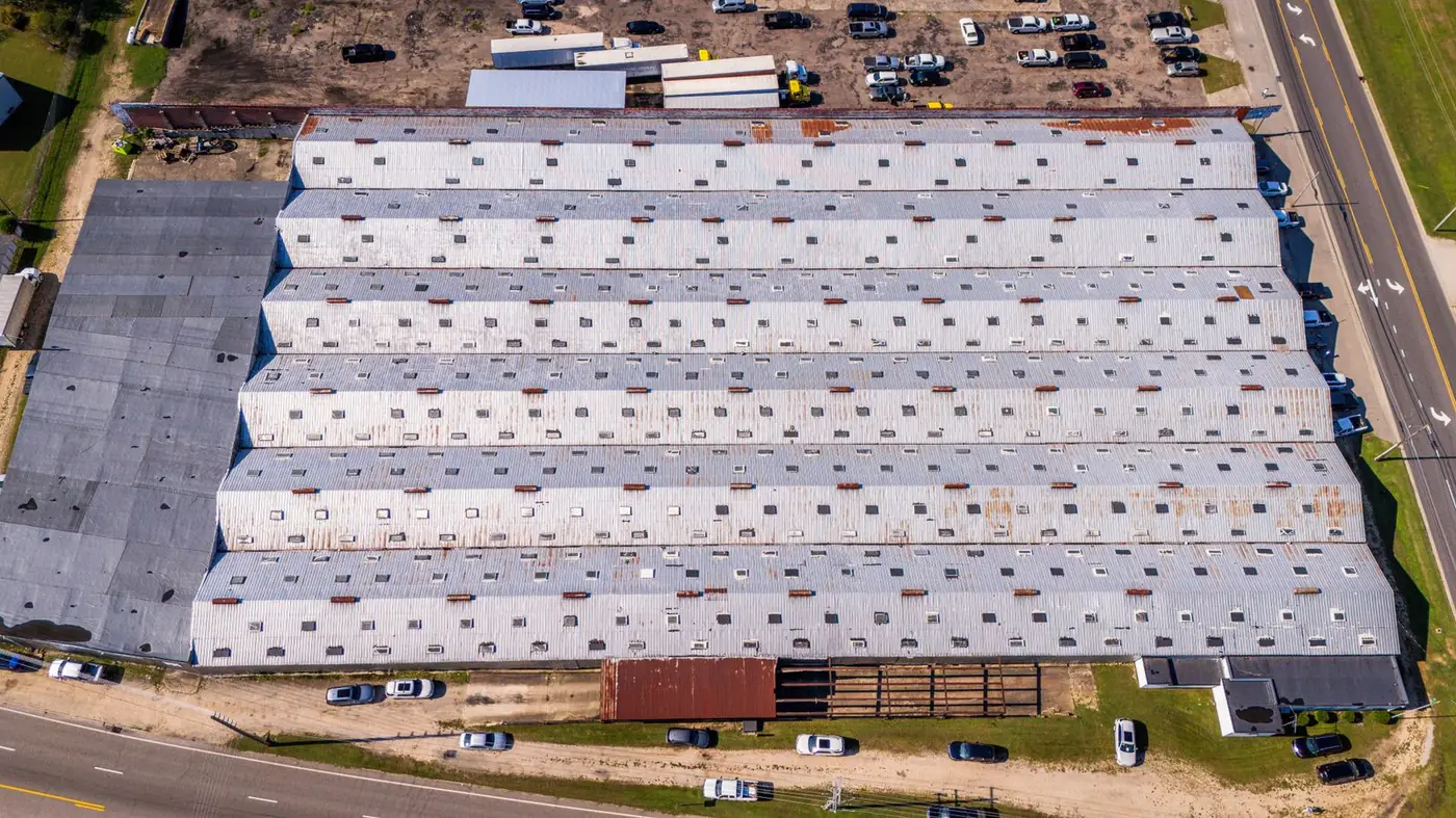 Aerial view of a large warehouse with a metal roof in Wilson, North Carolina